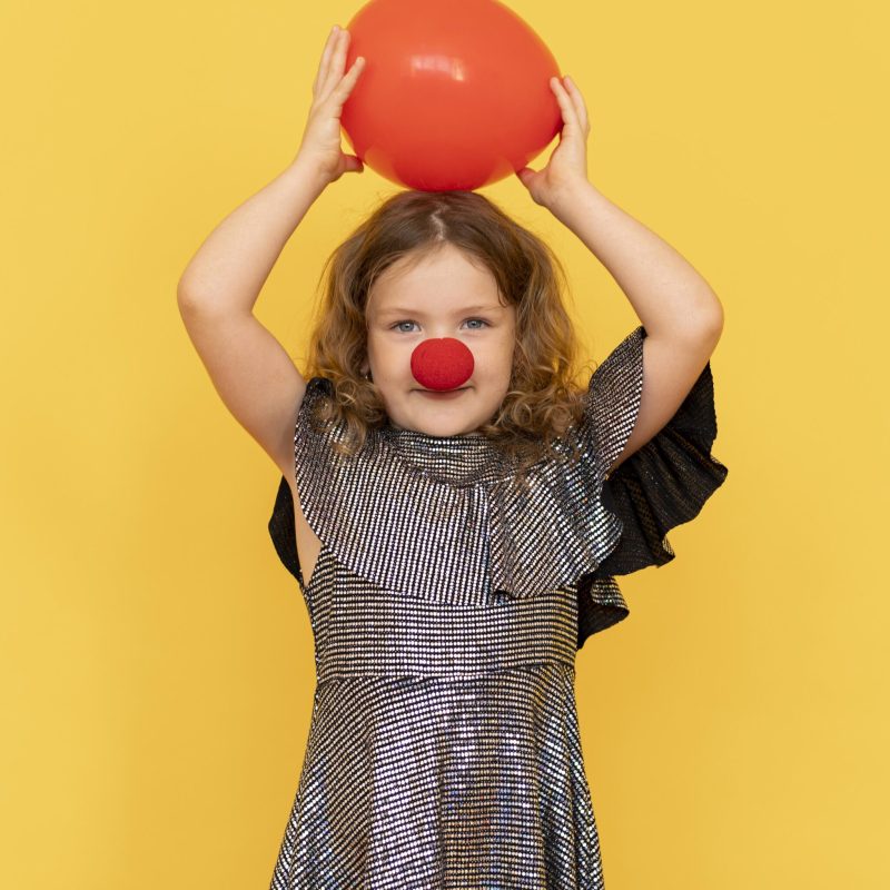 medium shot girl wearing clown nose